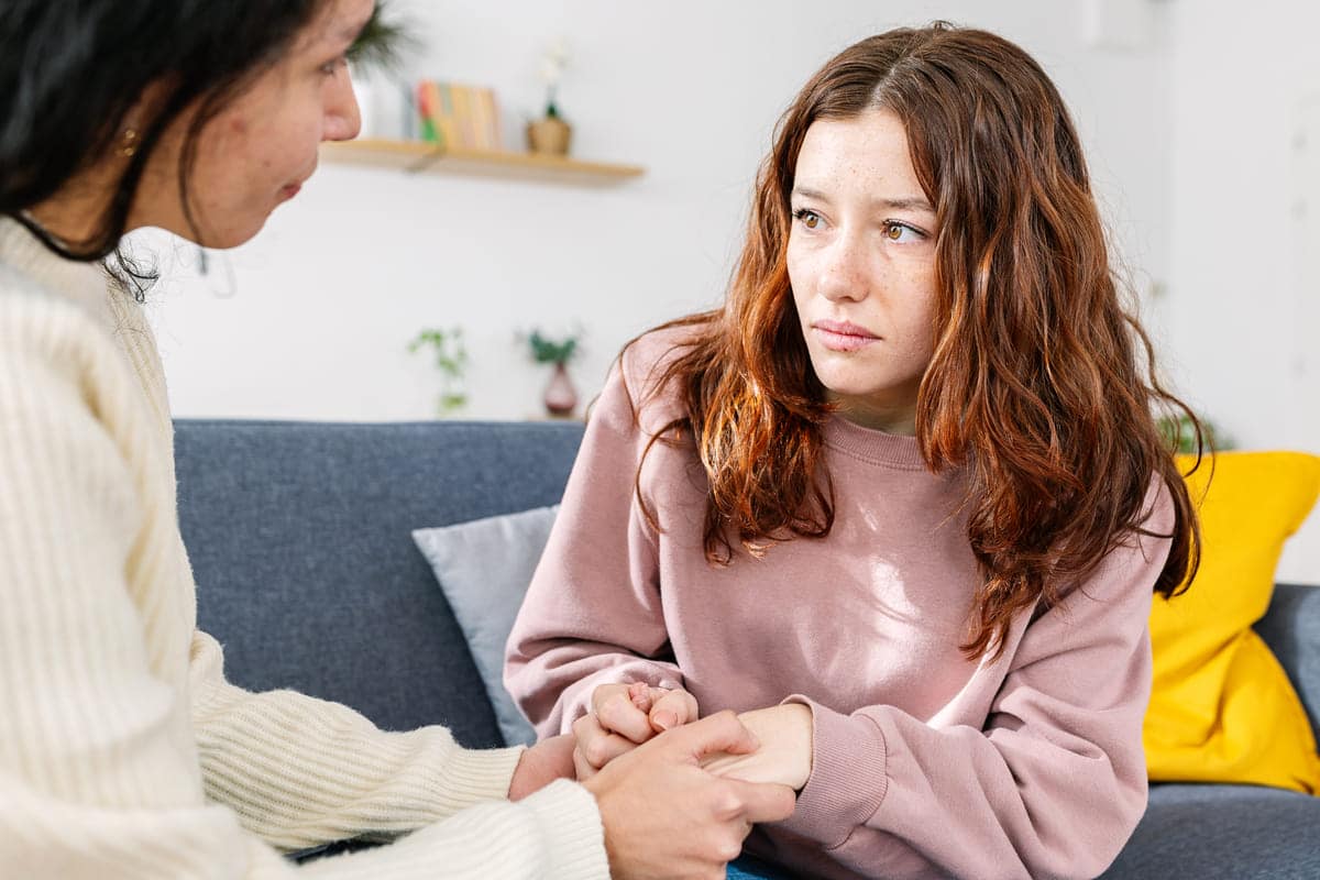 sad young teenage girl comforted by her friend at 2026 03 24 06 56 38 utc(1)